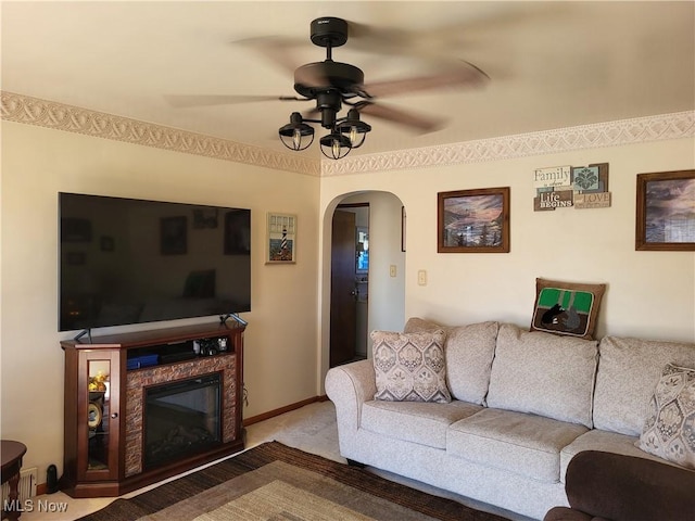 living room featuring ceiling fan and carpet floors