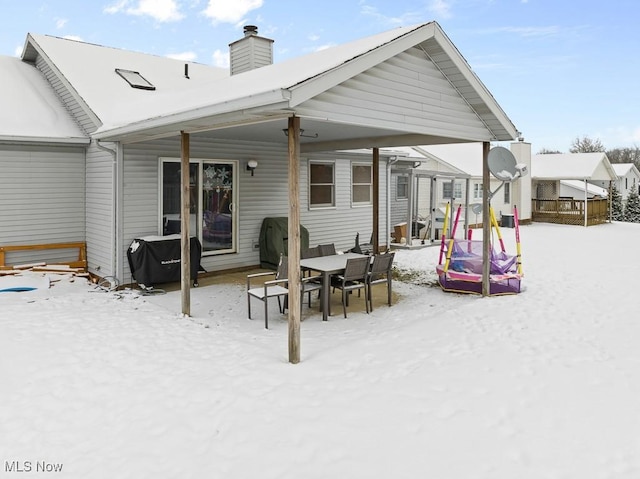 view of snow covered house