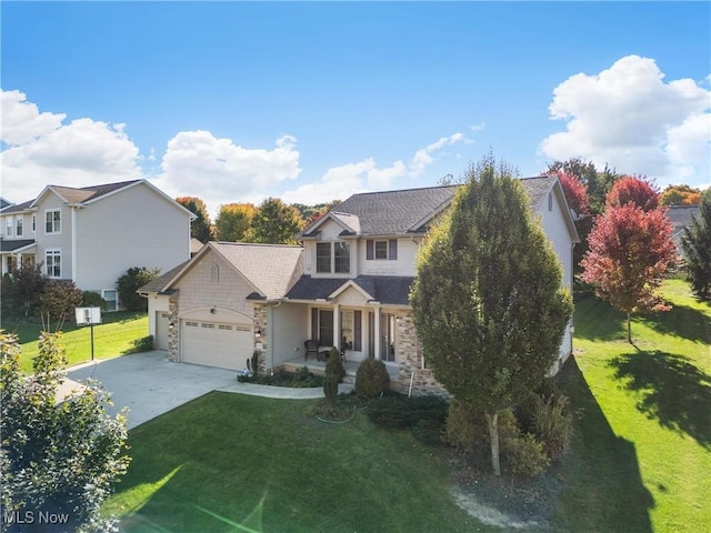 view of front of property featuring a garage and a front yard