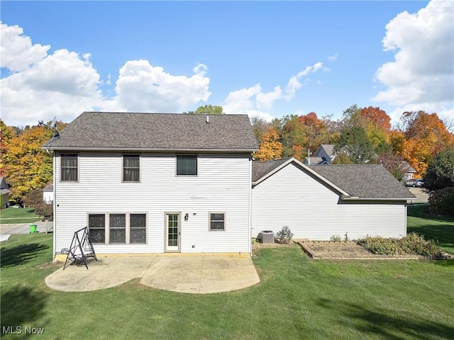 back of house featuring a patio area, cooling unit, and a lawn