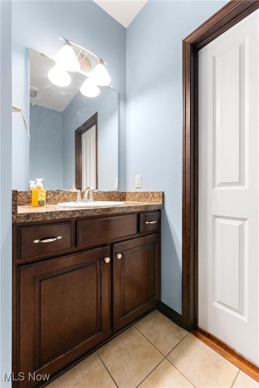 bathroom featuring vanity and tile patterned flooring