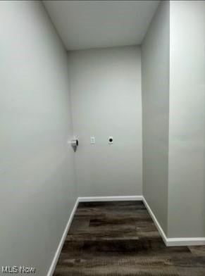 clothes washing area with dark hardwood / wood-style flooring and hookup for an electric dryer