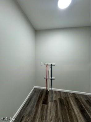 laundry room with dark hardwood / wood-style floors