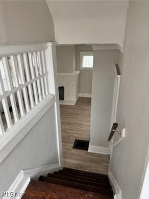 staircase featuring hardwood / wood-style floors