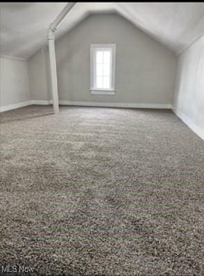 bonus room featuring vaulted ceiling