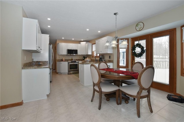 dining room with plenty of natural light, baseboards, and recessed lighting