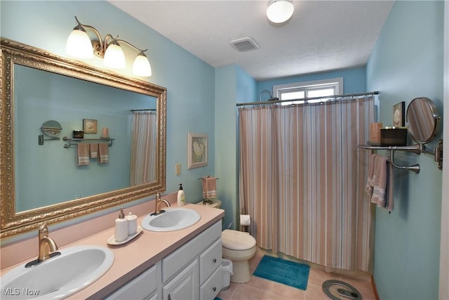 full bath featuring toilet, tile patterned flooring, a sink, and visible vents