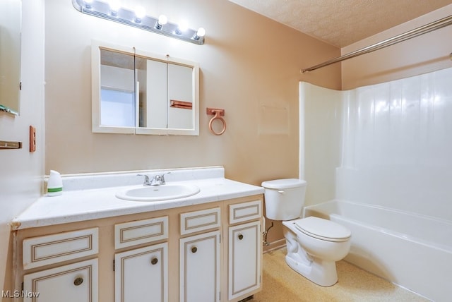 full bathroom with toilet, vanity, and shower / washtub combination