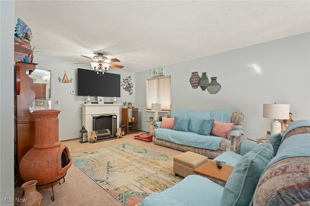 carpeted living room featuring a textured ceiling and ceiling fan