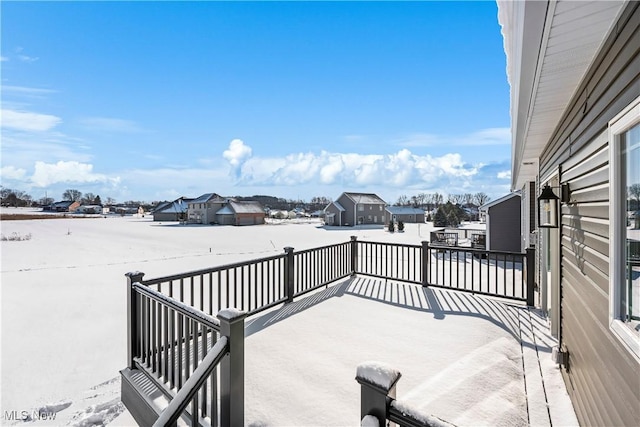 view of snow covered deck