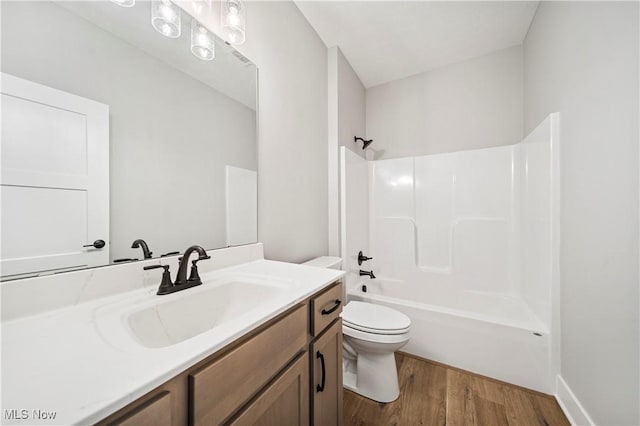 full bathroom with toilet, shower / bath combination, vanity, and hardwood / wood-style floors