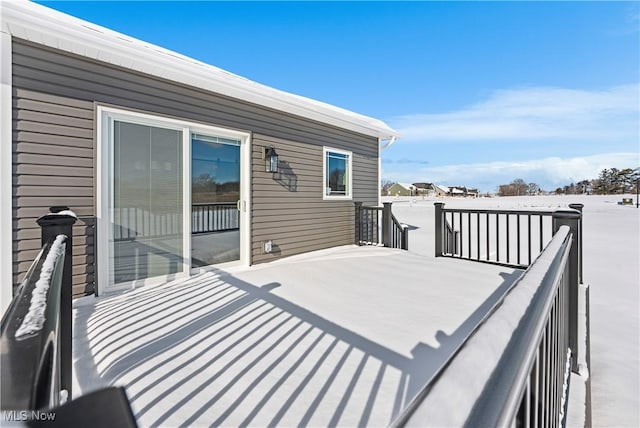 view of snow covered deck