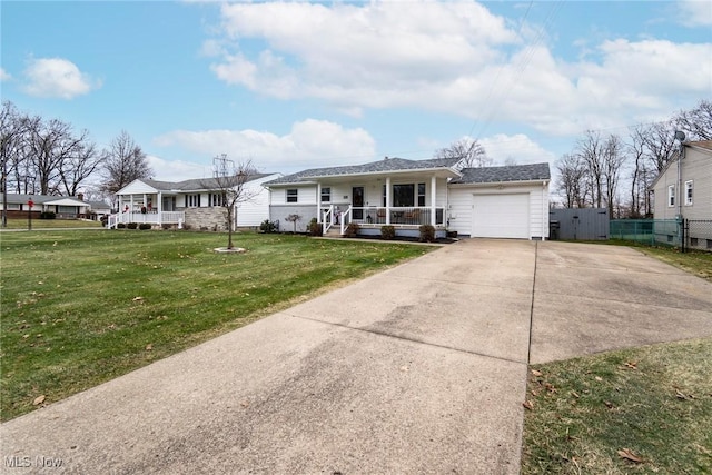 view of front facade featuring covered porch, a garage, and a front lawn