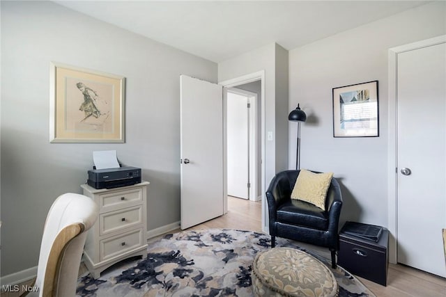 sitting room with light wood-type flooring