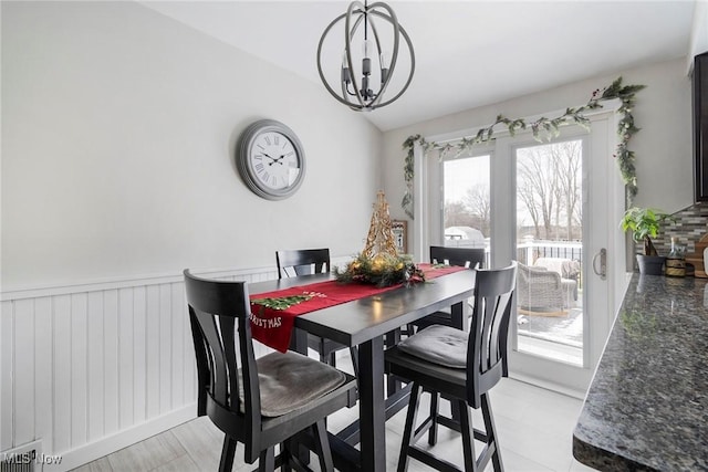 dining area with a chandelier and a healthy amount of sunlight