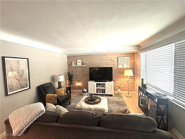 living room featuring wooden walls and wood-type flooring