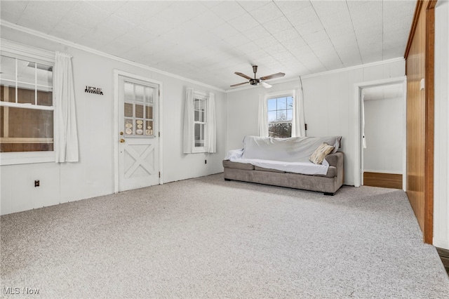 interior space featuring ceiling fan and crown molding