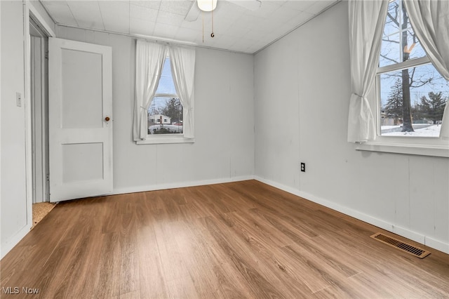 spare room featuring ceiling fan and hardwood / wood-style floors