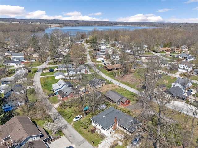 birds eye view of property featuring a water view and a residential view