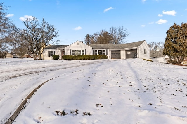 ranch-style home featuring a garage