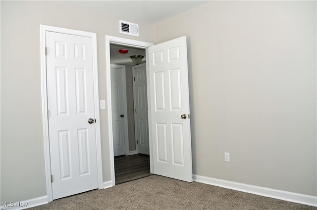 unfurnished bedroom with carpet