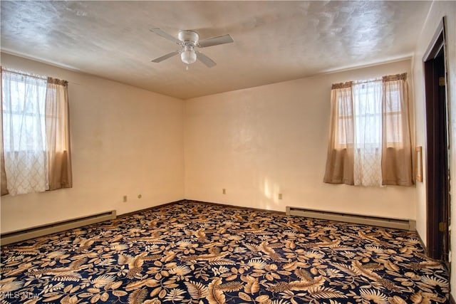 carpeted empty room with a baseboard radiator and ceiling fan