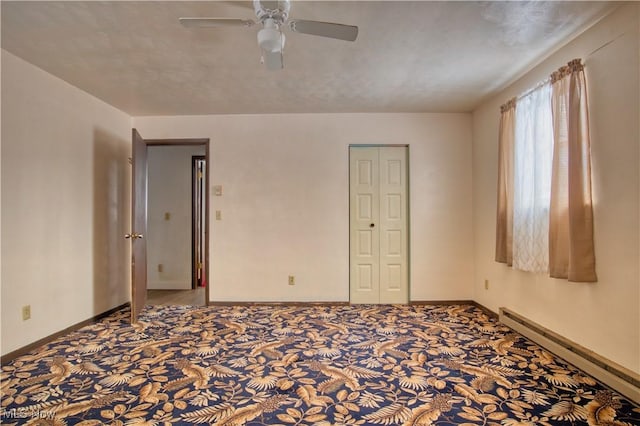 carpeted empty room featuring a baseboard radiator, a textured ceiling, and ceiling fan