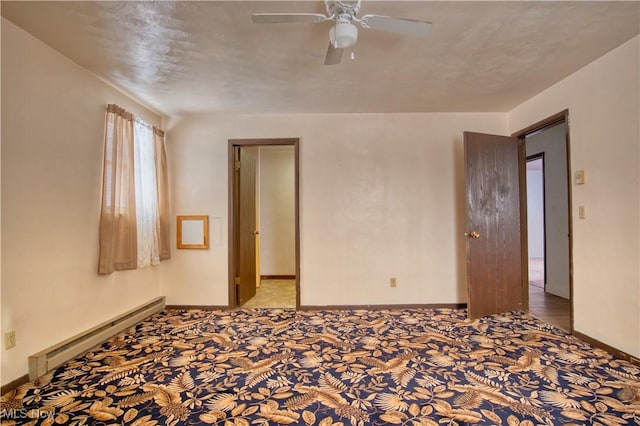 unfurnished room featuring baseboard heating, ceiling fan, carpet floors, and a textured ceiling