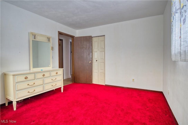 unfurnished bedroom featuring carpet flooring