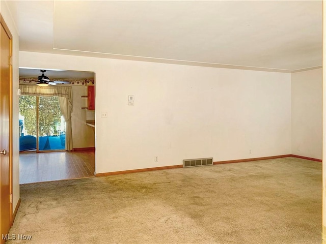 carpeted empty room with ceiling fan