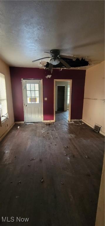 spare room with a textured ceiling and ceiling fan