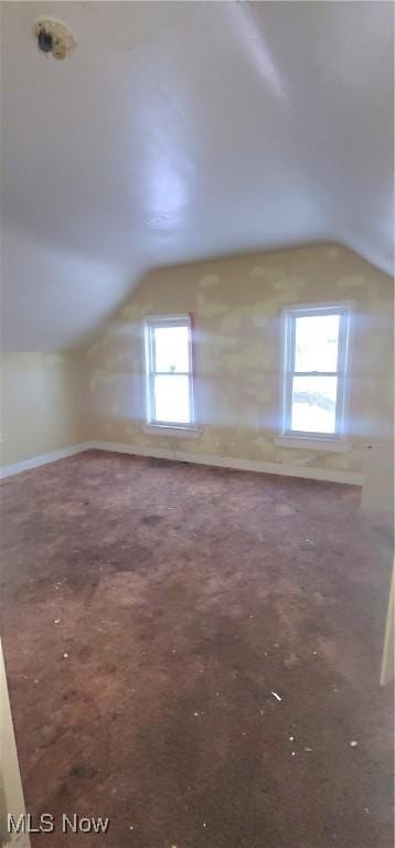 bonus room featuring lofted ceiling