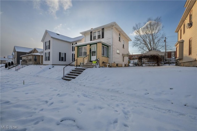 view of snow covered house