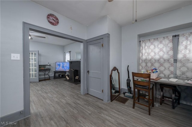 dining space featuring wood-type flooring