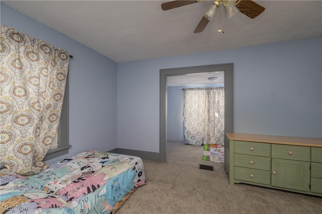 bedroom featuring ceiling fan and light colored carpet