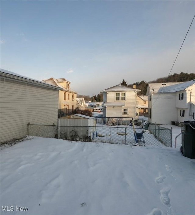 view of yard layered in snow