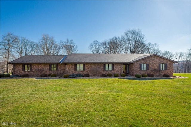 ranch-style house with a front lawn