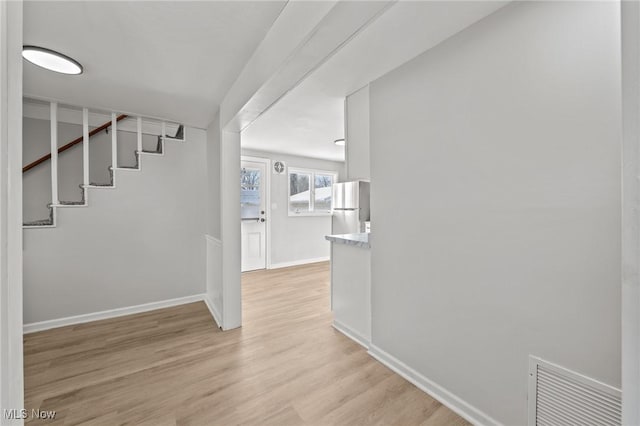 corridor featuring light hardwood / wood-style flooring