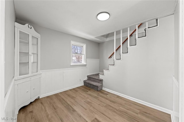 basement featuring light hardwood / wood-style flooring