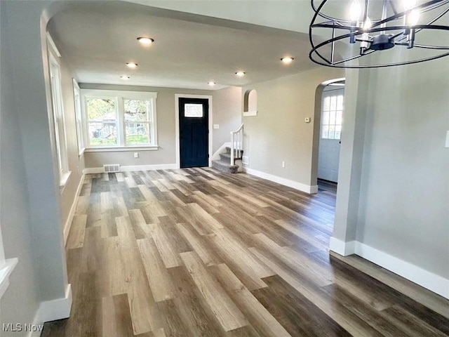 interior space featuring a notable chandelier and hardwood / wood-style floors