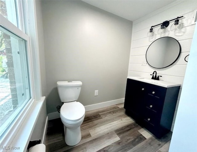 bathroom featuring hardwood / wood-style floors, toilet, and vanity