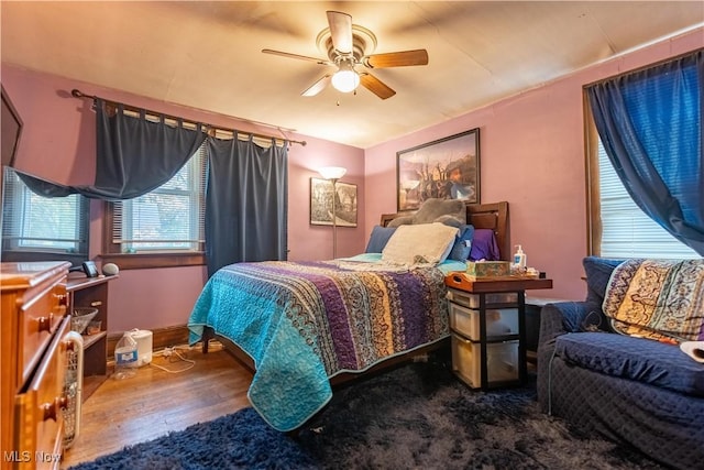 bedroom featuring hardwood / wood-style floors and ceiling fan