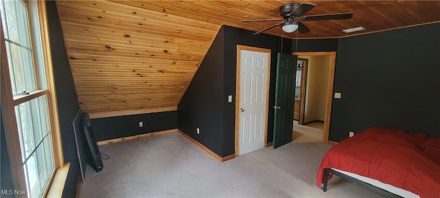 carpeted bedroom with lofted ceiling, visible vents, a ceiling fan, wooden ceiling, and baseboards