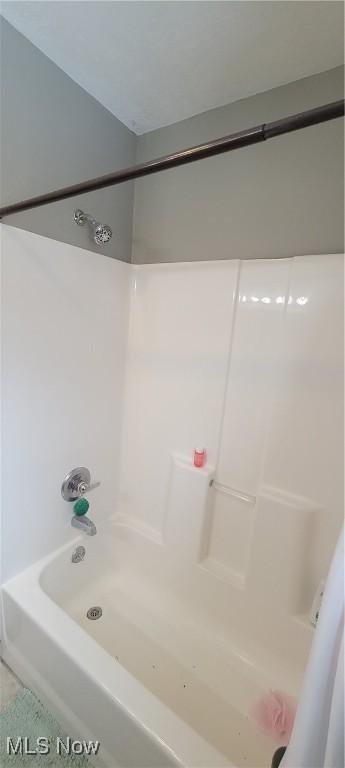 full bathroom featuring  shower combination