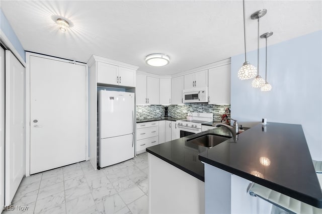 kitchen featuring white appliances, white cabinets, decorative light fixtures, sink, and kitchen peninsula