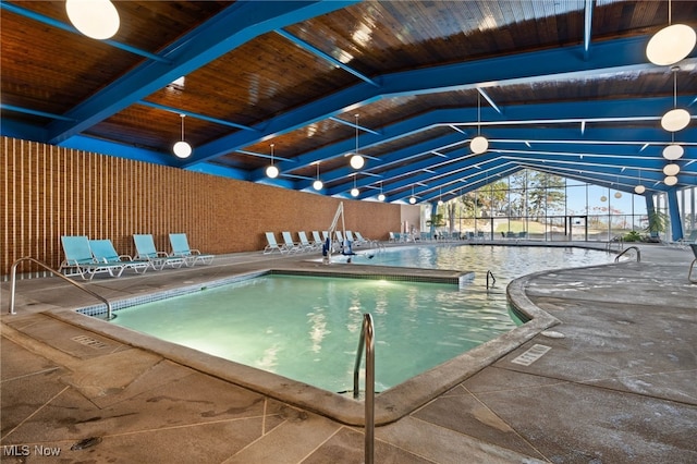 view of swimming pool with a patio area