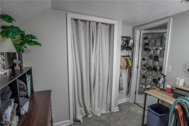 interior space with vaulted ceiling and dark carpet