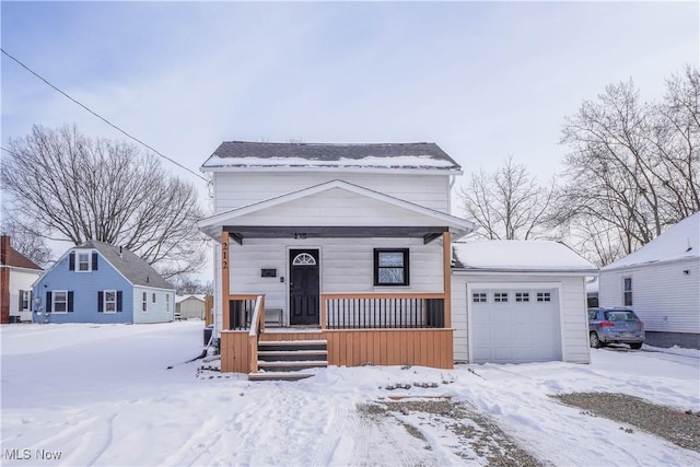 view of front facade featuring covered porch and a garage