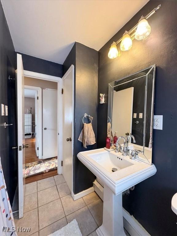 bathroom with tile patterned floors