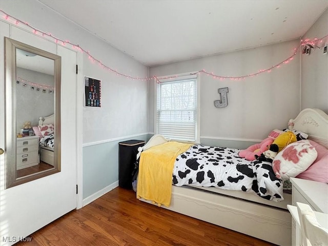 bedroom with wood-type flooring